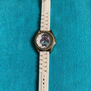 New white watch with gorgeous owl surrounded by pink and white Cubic zirconia.